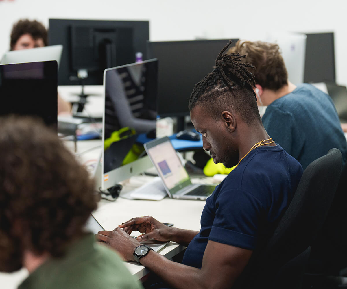 Office workers using computers and laptops